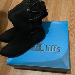 Cliffs by white mountain below the knee boots. Size 7 black suede.